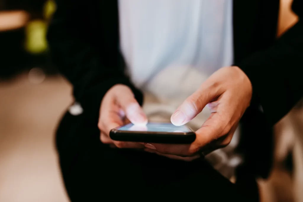 close up view of unrecognizable woman using mobile utc