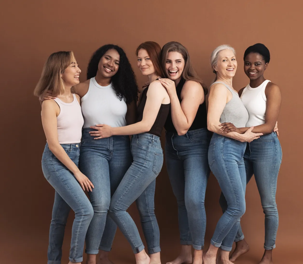 group of multi ethnic women in casuals posing toge utc