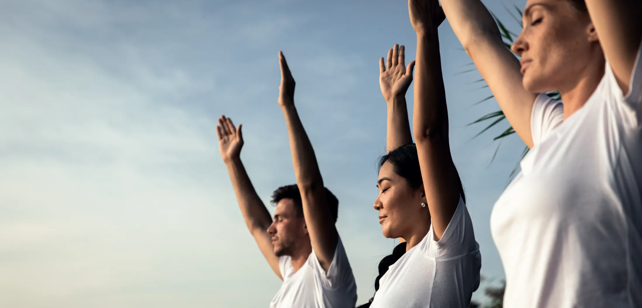 group of people doing yoga exercises by the lake a utc