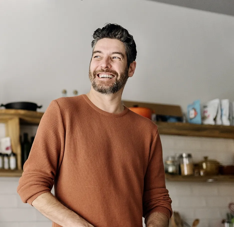 man preparing food in kitchen utc