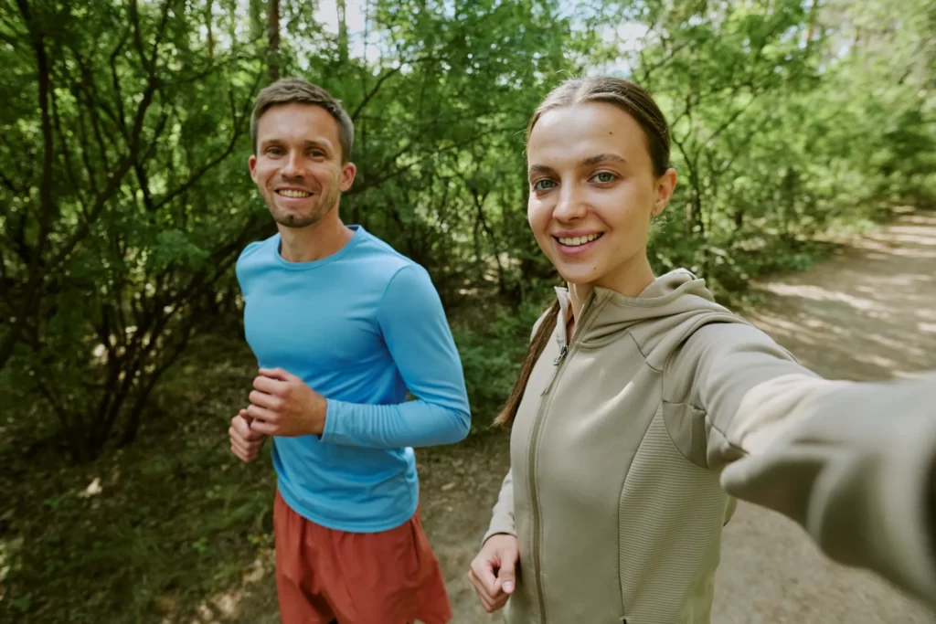 portrait of caucasian young man and woman jogging utc