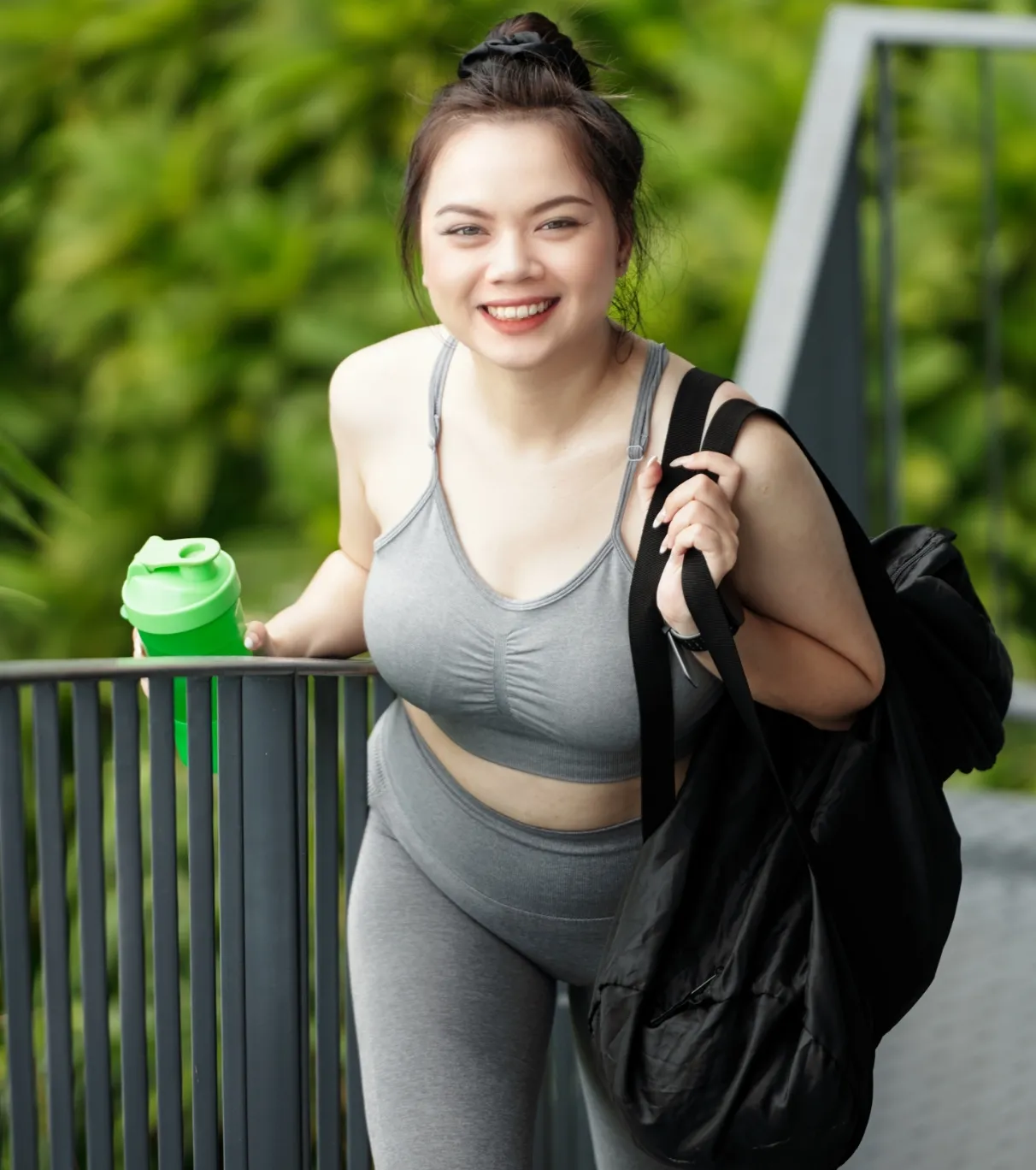sportswoman with gym bag walking to gym utc