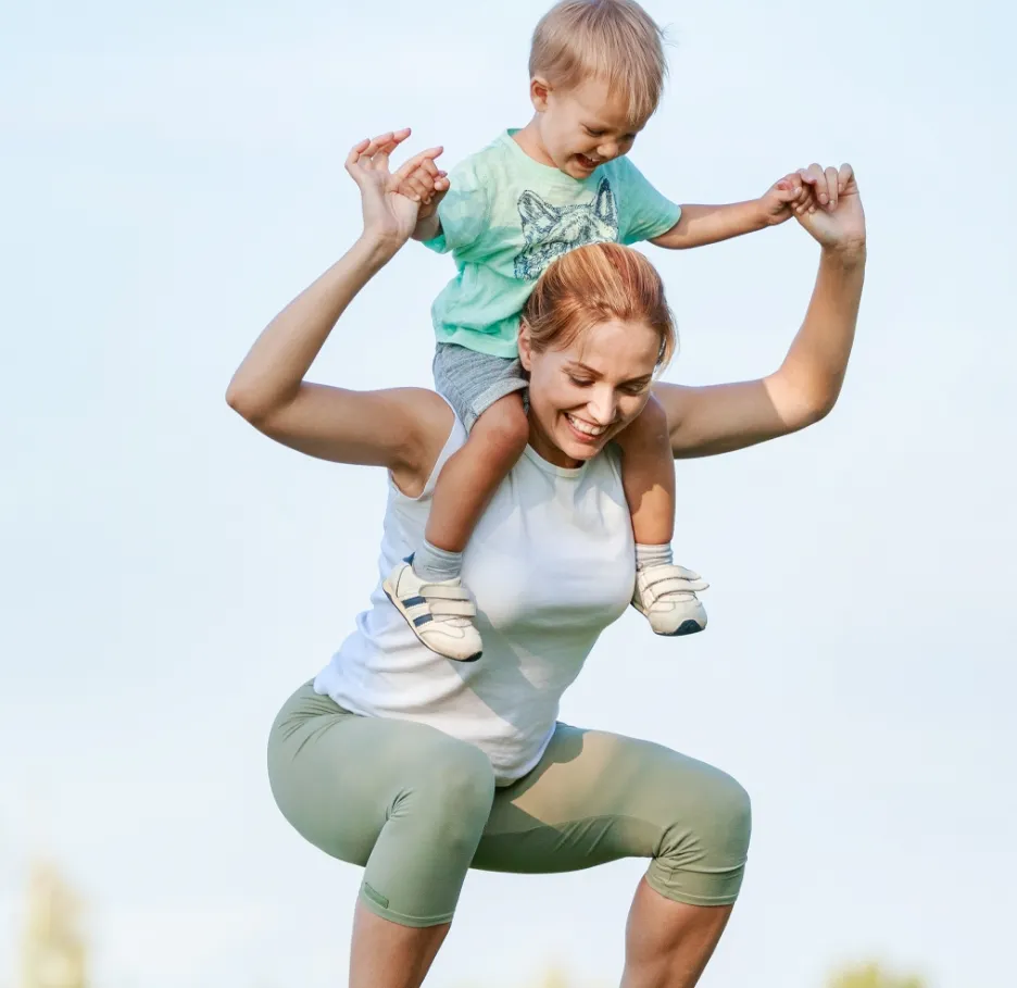 young fitness woman working out with son on should utc
